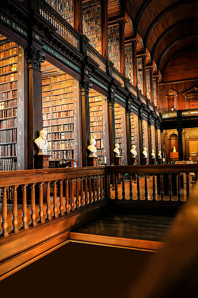 Dublin Eire - November 17, 2013: Thousands of books on shelves inside the Trinity College Library Dublin, part of the University of Dublin 